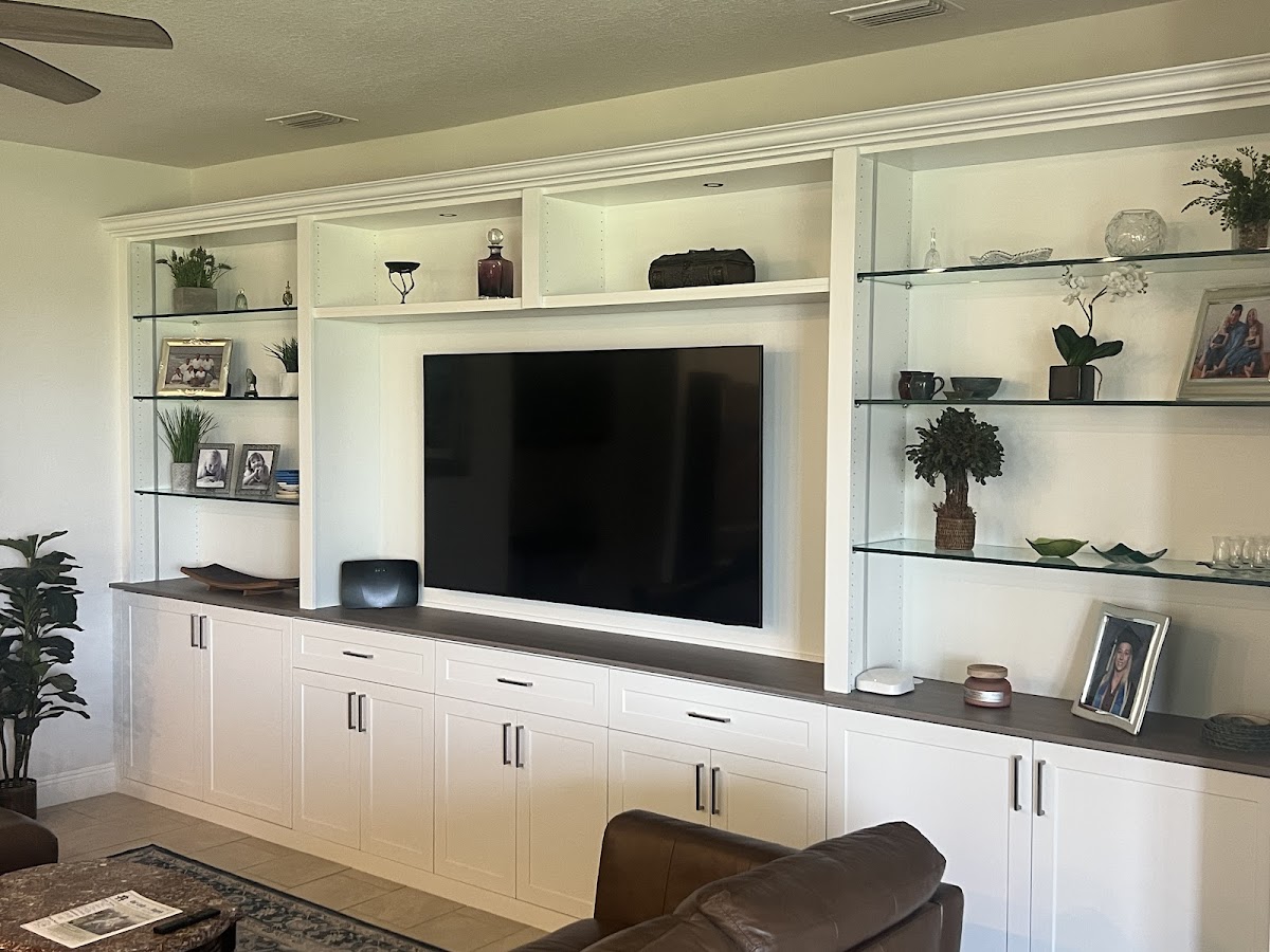 Custom closet organization system with hanging zones, shelving, and drawer units in Venice FL by Dream Closets LLC