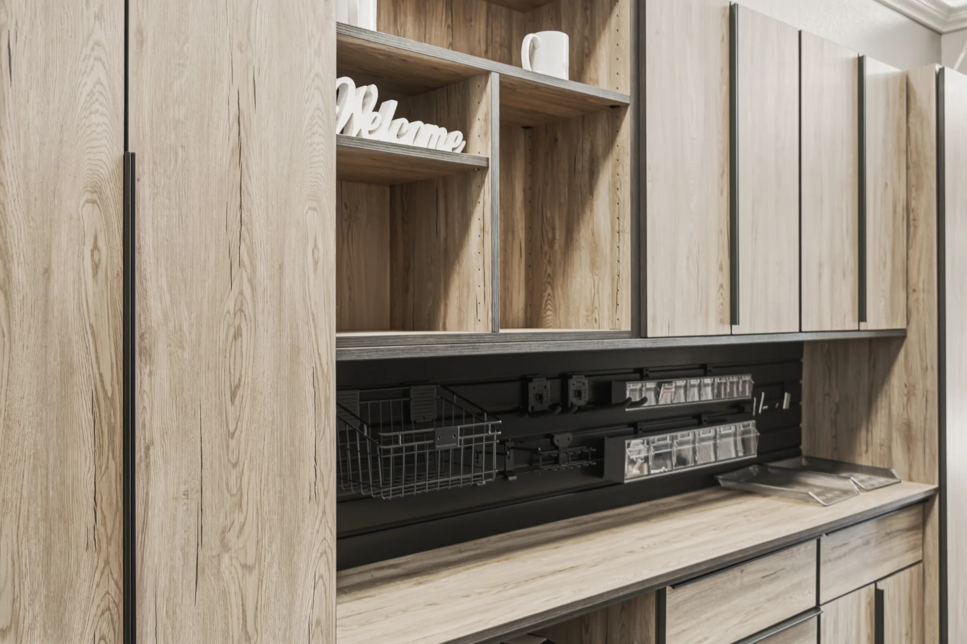 Dream Closets LLC showroom natural wood office storage unit with hidden desk and charging station in Bradenton FL